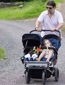 A dad pushing stroller