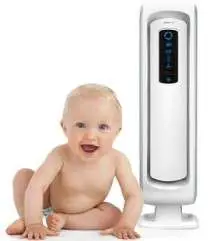 baby sitting near an air purifier