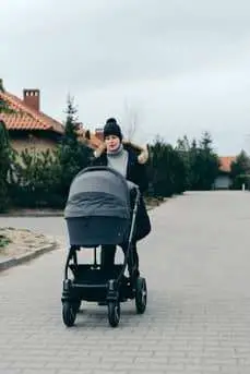 mom pushing a baby stroller