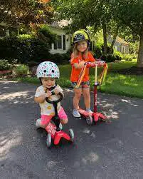 kid riding a scooter