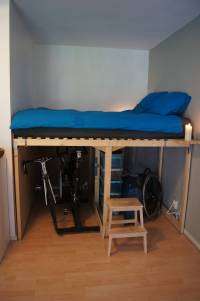 tall bed with bikes underneath