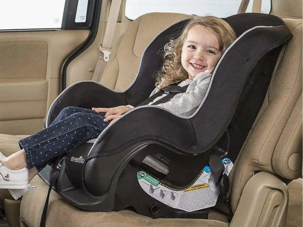 compact car seat with kid in